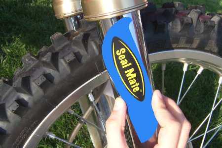 Slide the back end of the Seal Mate tool into the fork then rotate the tool to be parallel with the fork tube.