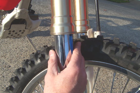 Slide the dust seal back up into the fork